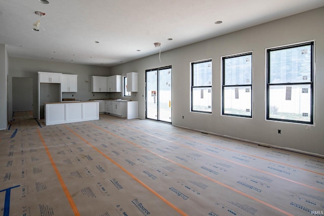 18609 Bracken Fern Ct, South Bend, IN 46637 - kitchen with white cabinets and open floor plan