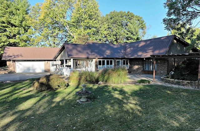 single story home with a front yard and a garage