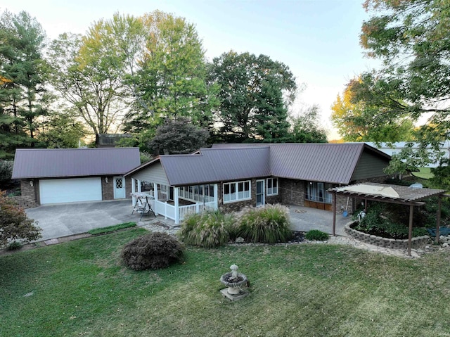 ranch-style home with a front lawn and a garage