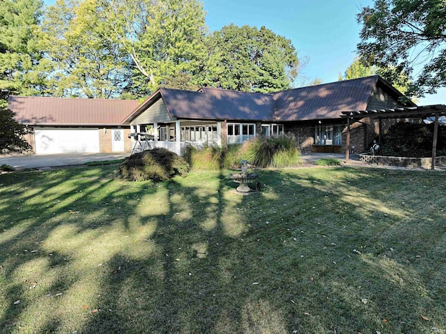 single story home featuring a front yard and a garage