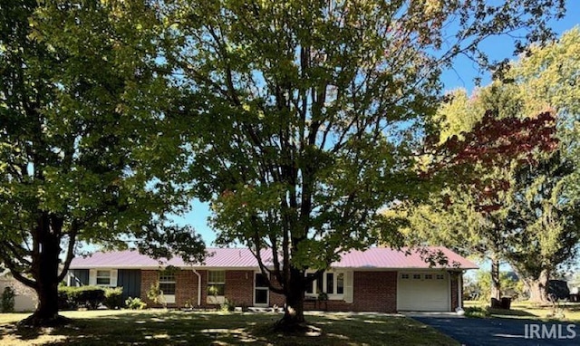 single story home with a front lawn and a garage