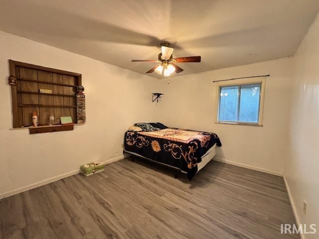 bedroom with wood-type flooring and ceiling fan