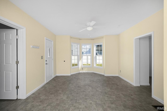 unfurnished room with ceiling fan