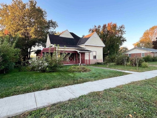 view of front of home with a front lawn and covered porch