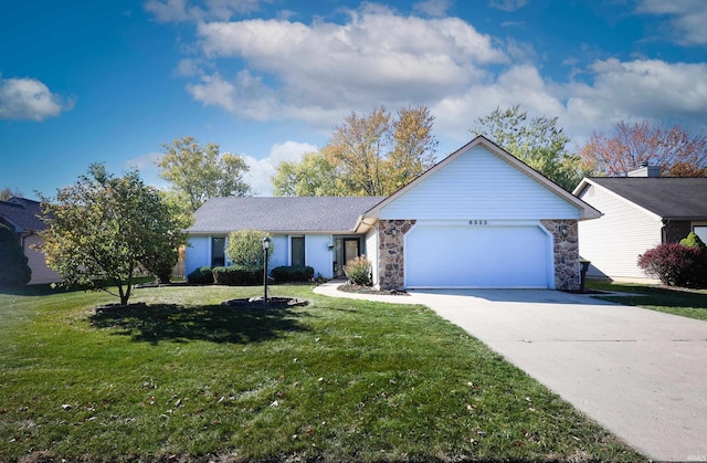 ranch-style house featuring a garage and a front yard