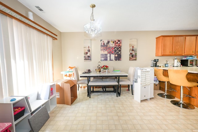 interior space with a chandelier and decorative light fixtures