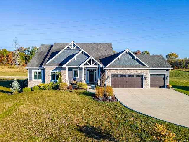 craftsman-style house with a front yard and a garage