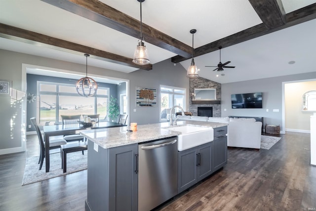 kitchen with dishwasher, hanging light fixtures, gray cabinetry, a center island with sink, and sink