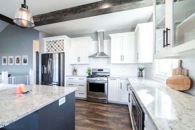 kitchen with hanging light fixtures, dark hardwood / wood-style flooring, white cabinetry, wall chimney exhaust hood, and stainless steel appliances