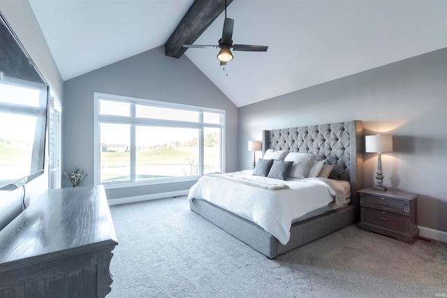 bedroom with ceiling fan, carpet, and vaulted ceiling with beams