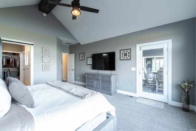 bedroom with a spacious closet, ceiling fan, light carpet, and beam ceiling