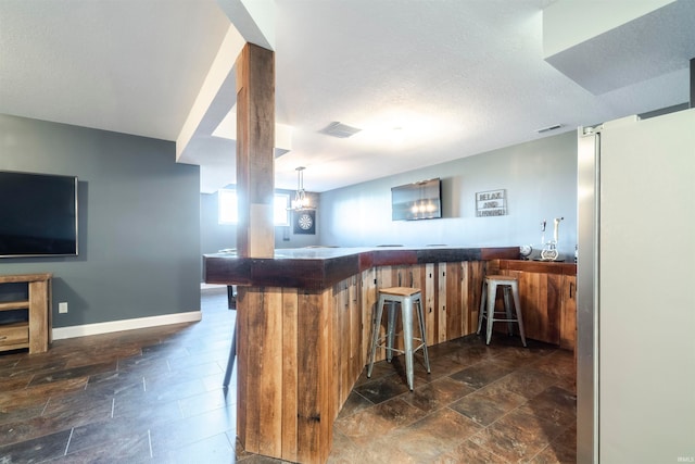 bar with a textured ceiling