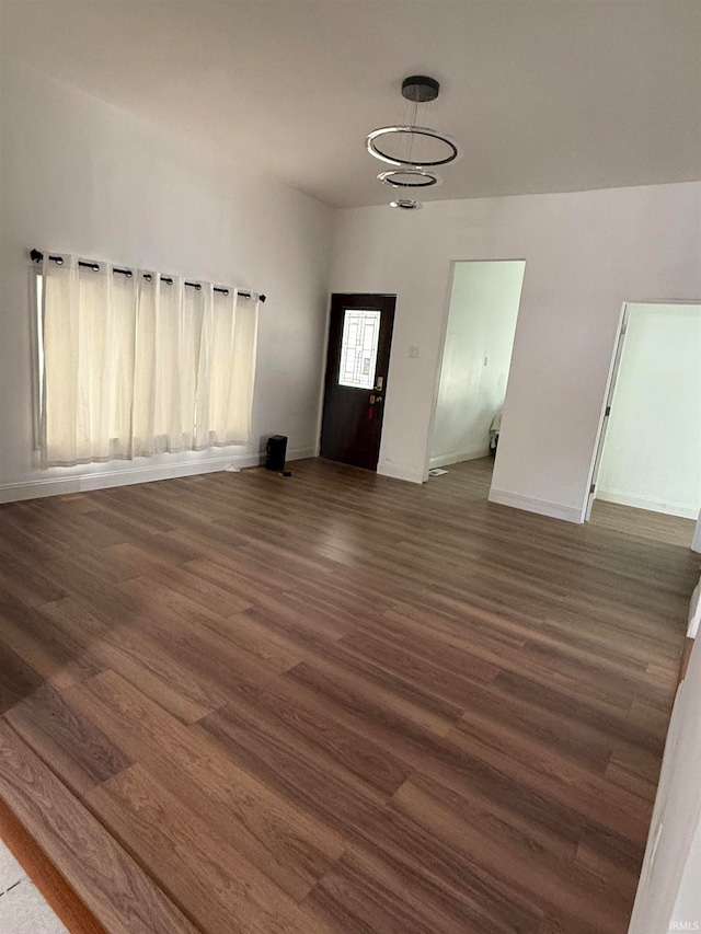 interior space featuring a chandelier and dark hardwood / wood-style flooring