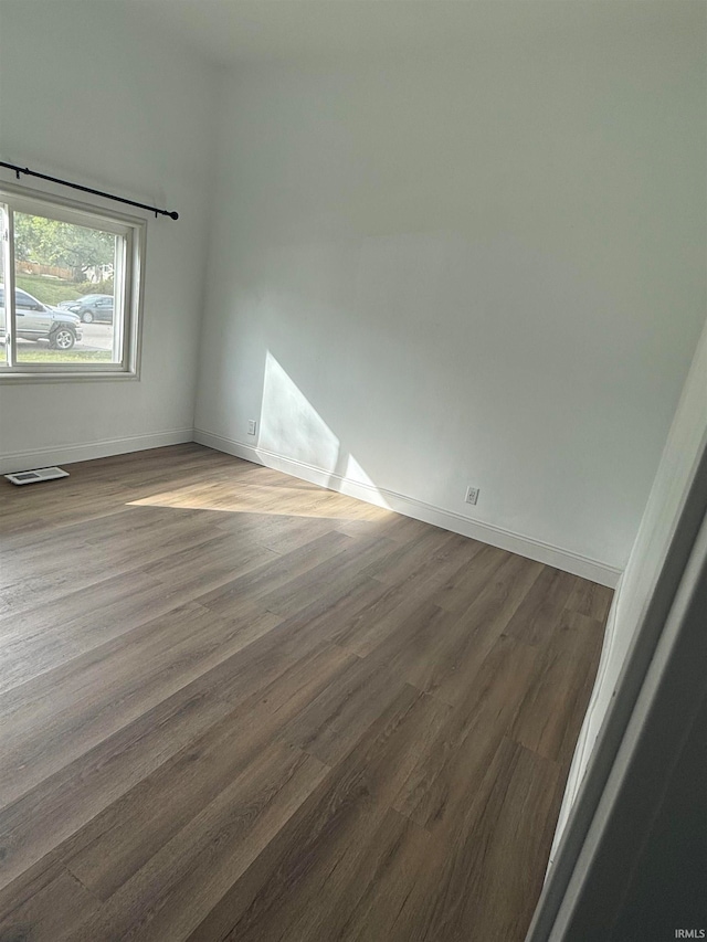 unfurnished room featuring wood-type flooring