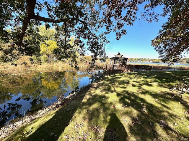 view of yard with a gazebo and a water view