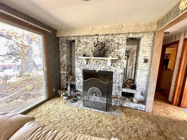 interior space featuring a fireplace and carpet floors