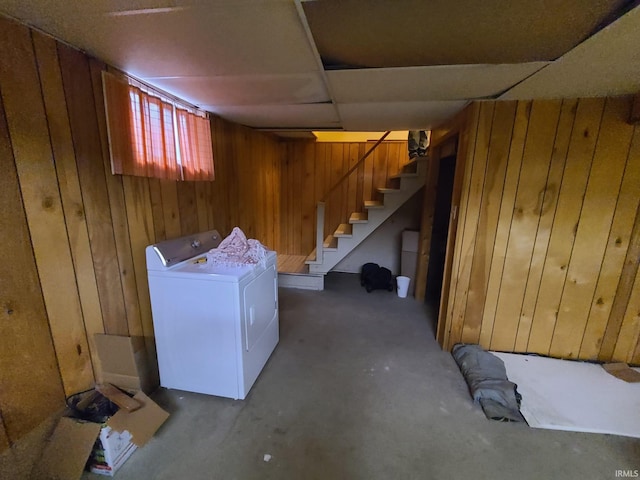 basement featuring wood walls