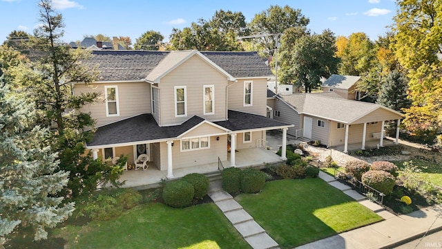 view of front of property featuring covered porch and a front lawn