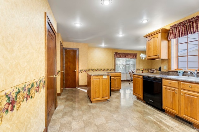 kitchen with black dishwasher, sink, a center island, and a chandelier