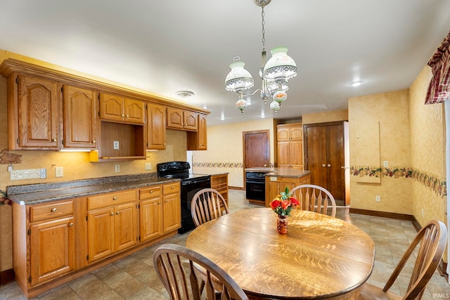 kitchen with black electric range oven, an inviting chandelier, and a kitchen island