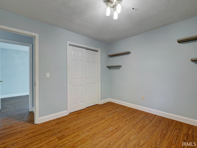 unfurnished bedroom featuring a closet and light hardwood / wood-style floors