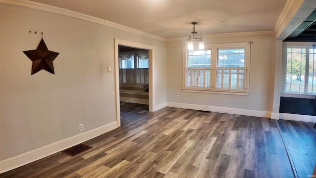 unfurnished dining area with ornamental molding, a chandelier, and dark wood-type flooring