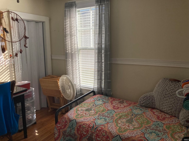 bedroom with wood-type flooring