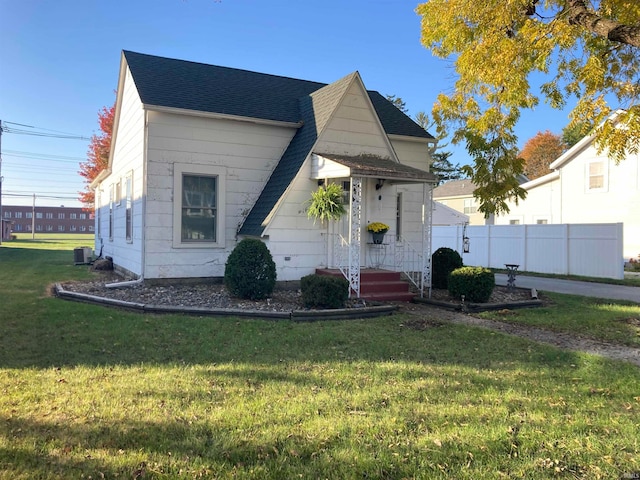 bungalow-style home with a front yard