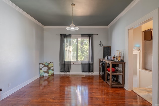 dining room featuring ornamental molding and hardwood / wood-style flooring