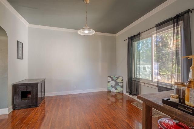 interior space with crown molding and hardwood / wood-style flooring