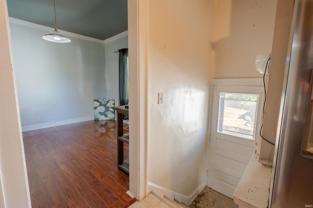 corridor featuring crown molding and wood-type flooring