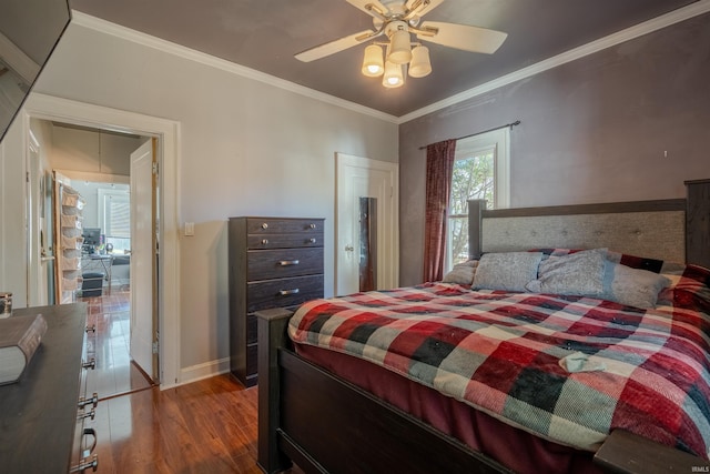 bedroom featuring ornamental molding, wood-type flooring, and ceiling fan