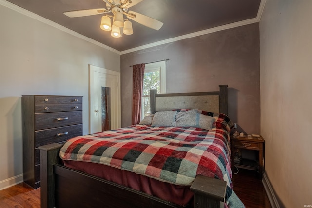 bedroom with dark wood-type flooring, crown molding, and ceiling fan