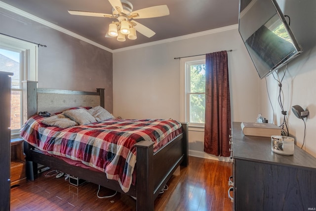 bedroom with ornamental molding, ceiling fan, and dark hardwood / wood-style flooring