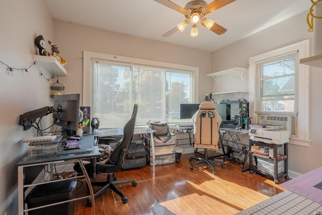 home office with ceiling fan, wood-type flooring, and cooling unit