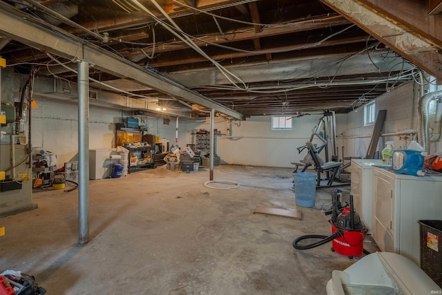 basement with washing machine and clothes dryer