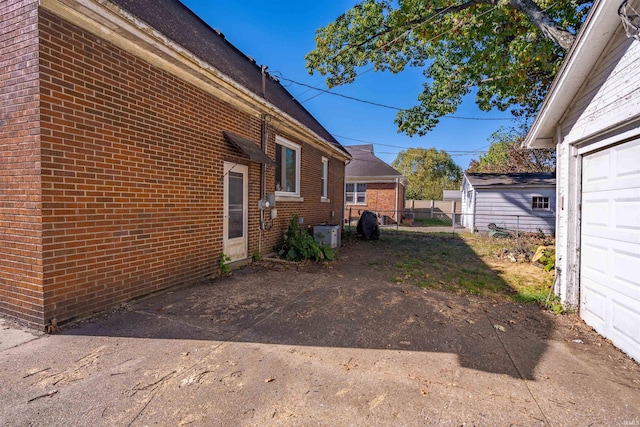 view of side of property with a garage