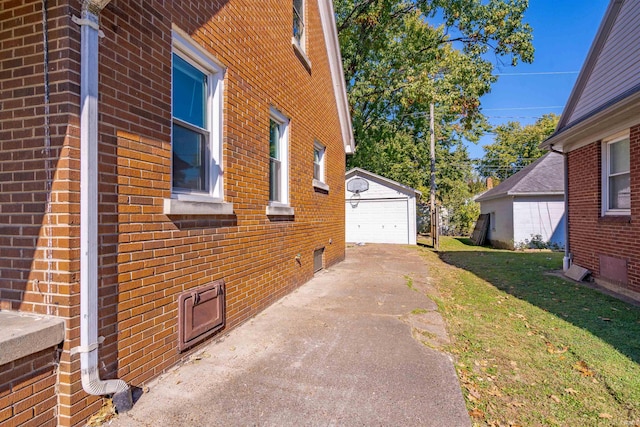 view of property exterior with a yard, an outbuilding, and a garage