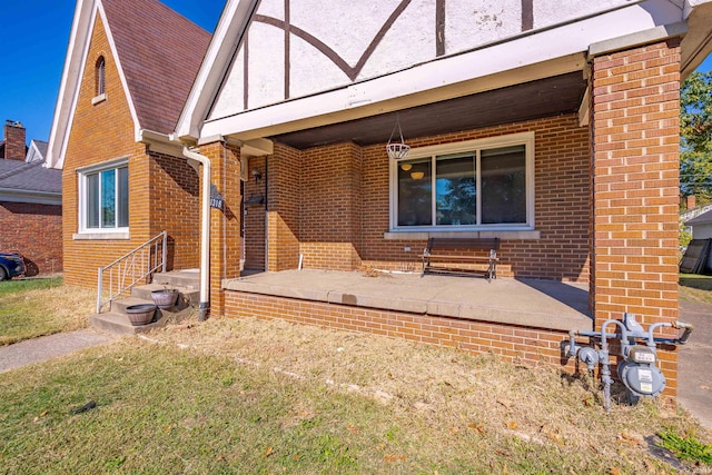 exterior space with a patio area and a lawn