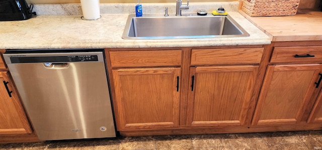 kitchen featuring stainless steel dishwasher and sink