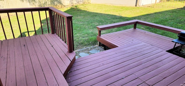 wooden terrace with a lawn