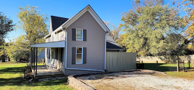 view of property exterior featuring a lawn