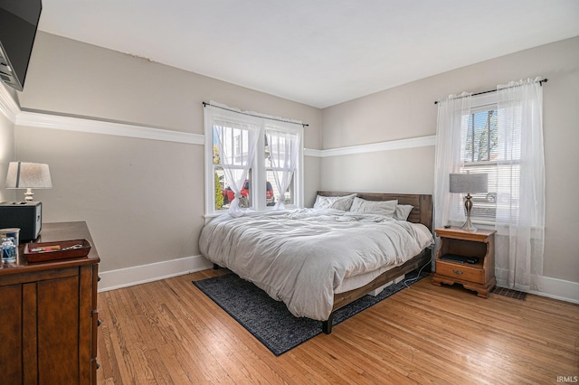 bedroom featuring light wood-type flooring