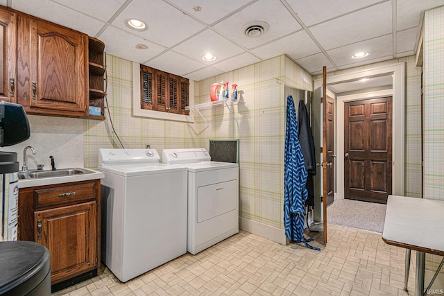 washroom with sink and separate washer and dryer