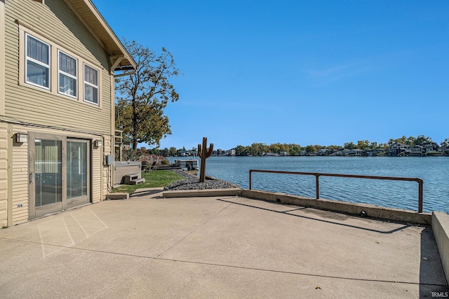 view of patio with a water view