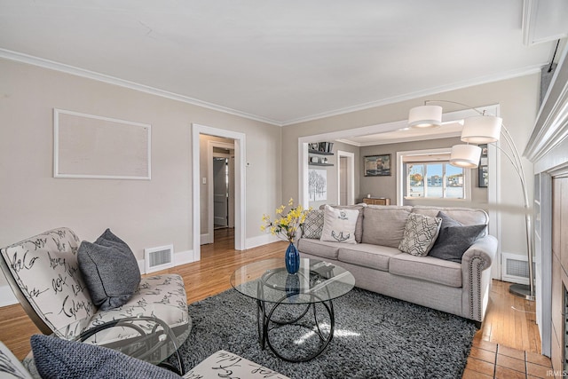 living room featuring hardwood / wood-style flooring and ornamental molding