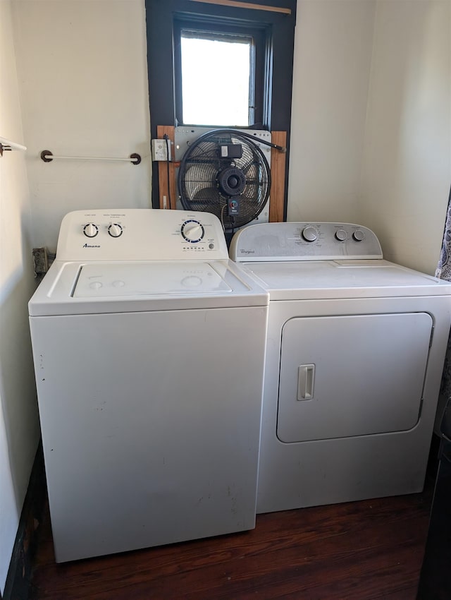 laundry area featuring washing machine and clothes dryer and dark hardwood / wood-style flooring