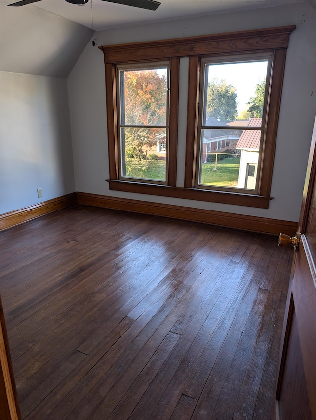 additional living space with dark wood-type flooring, vaulted ceiling, and ceiling fan