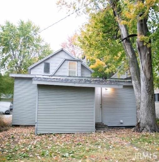 view of property exterior with a garage