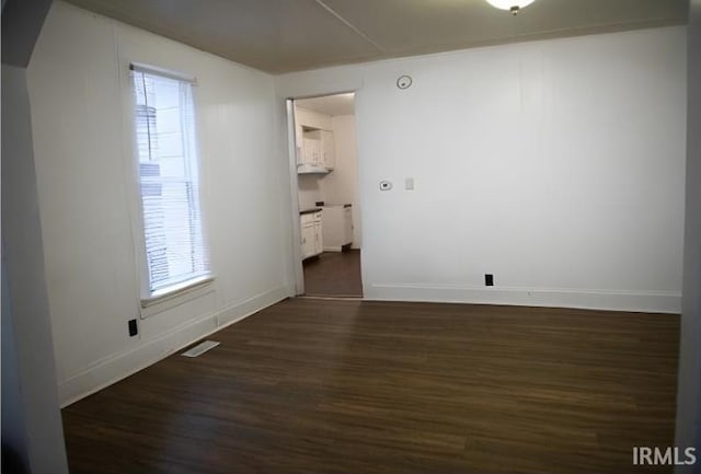 empty room featuring dark hardwood / wood-style floors